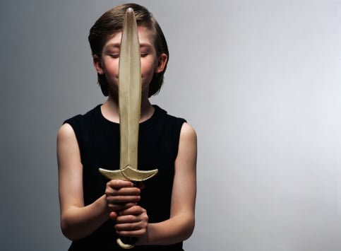 Boy holding a plastic sword