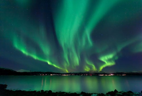 Green light flashing across the sky over the sea, as we study about Creation in the Word of God