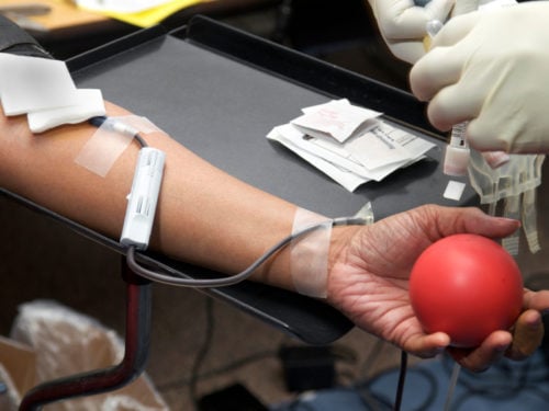 man giving blood as an act of service