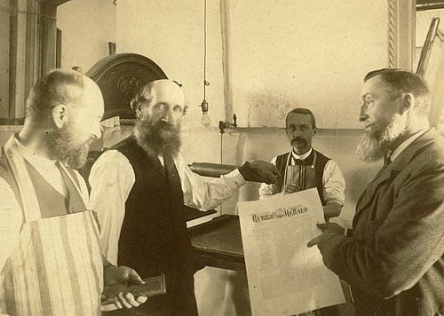 Publishing Uriah Smith, right, and other Adventist publishing leaders reenact in the 1890s the early days of the church’s publishing ministry. [photos courtesy Office of Archives, Statistics and Research]