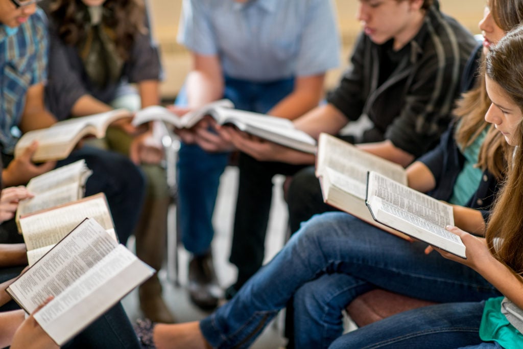 youth group sitting in a circle having a bible study