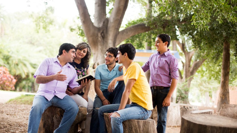 Family studying the bible together to learn about prophets