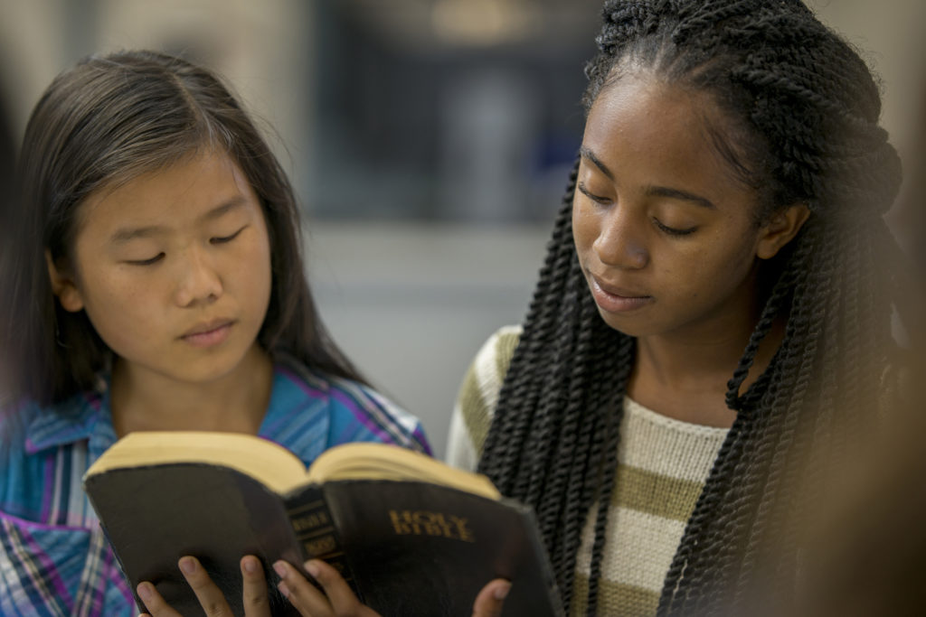 two young women having a beginners bible study together