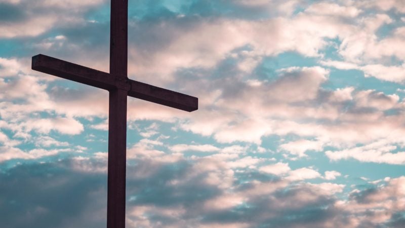 Cross with clouds in background