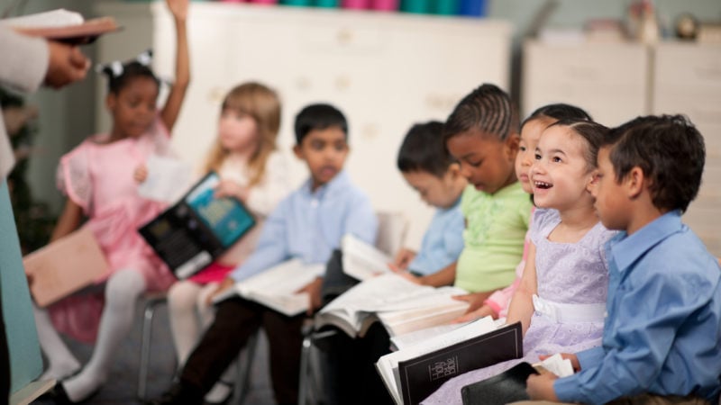 Children sitting in Sabbath School group of children sitting in a Sabbath school class