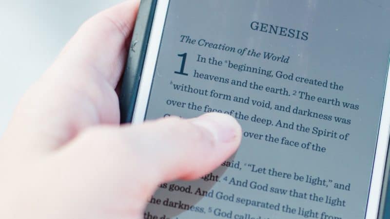 Biblical book of Genesis open on smartphone