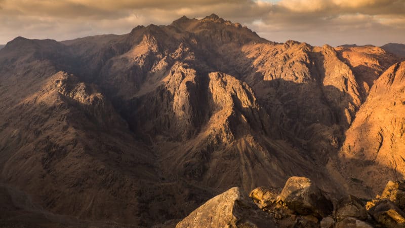 Mountain range that is brown and dry, similar to the earth on day 3 of creation before God created all vegetation and life.