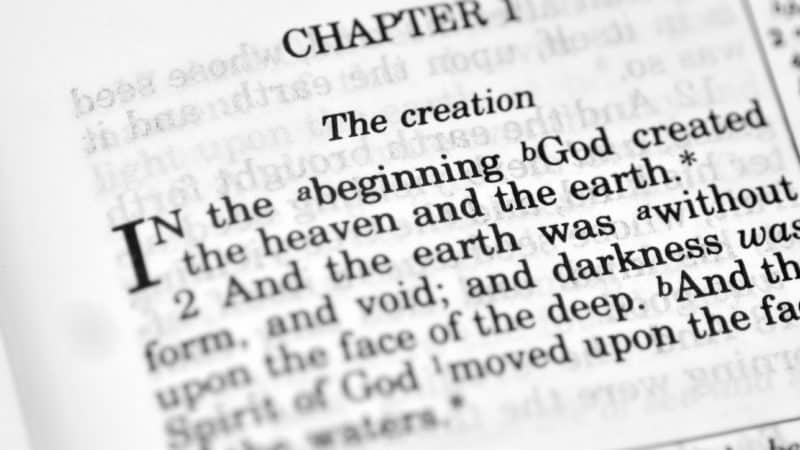 Bible open to Genesis chapter 1