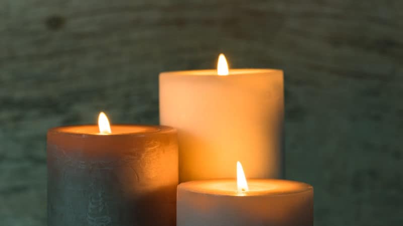 Three lit candles