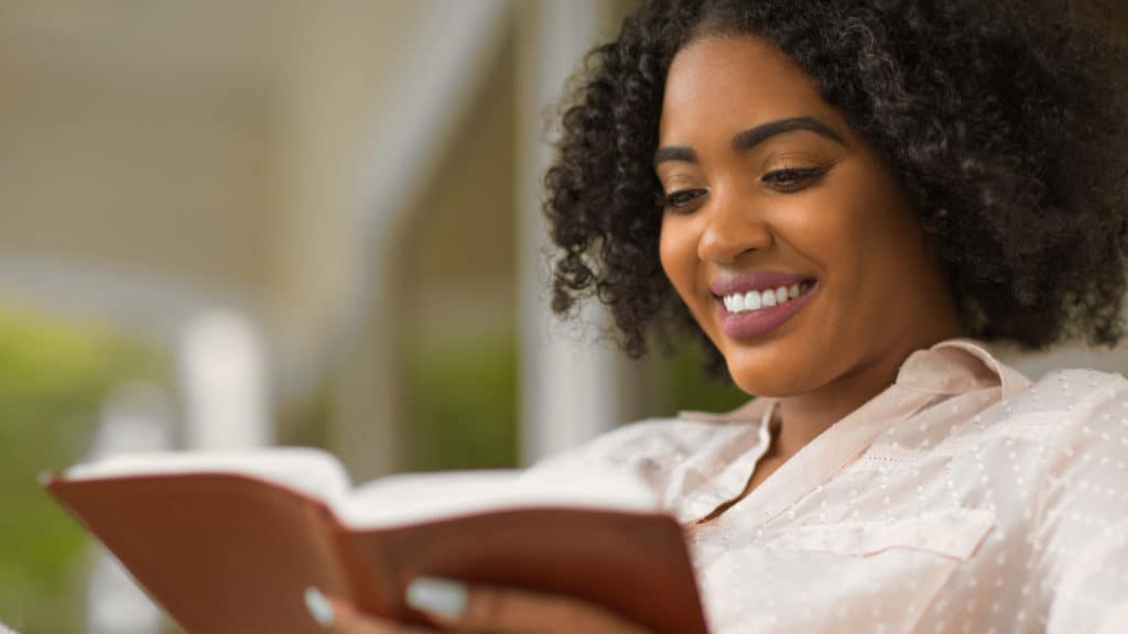 Woman reading and studying the Bible.