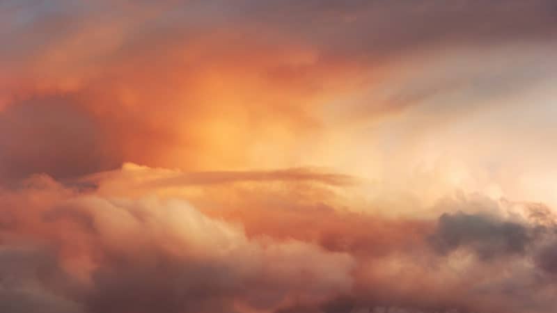 red sunset sky over clouds in the heavens