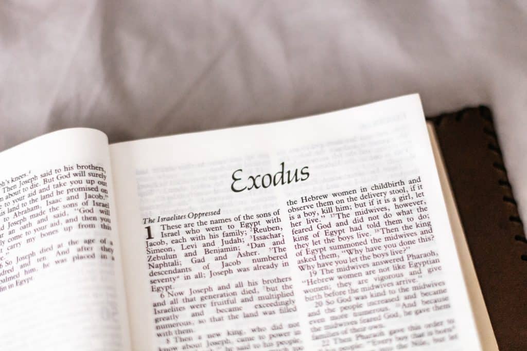 the Bible open to the first chapter of the book of Exodus