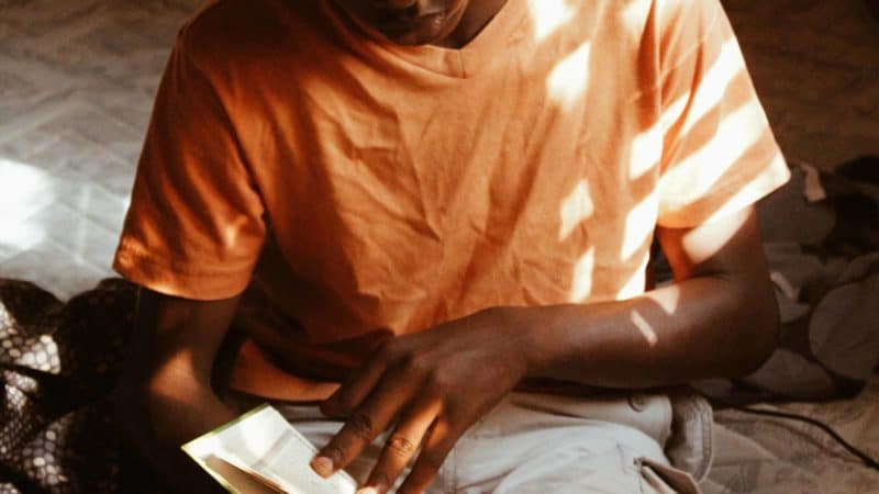 Boy studying the Bible.