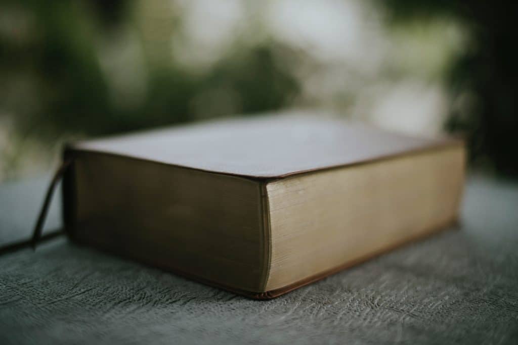 A closed Bible on a table.