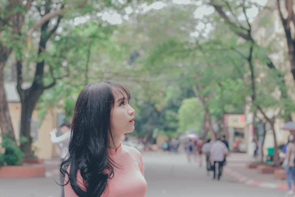 A young woman looking up at the sky