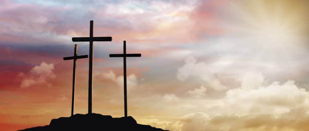 Three crosses on a hill.