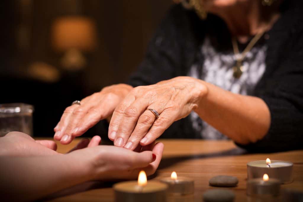 Close-up of spiritualistic seance in fortune telling salon