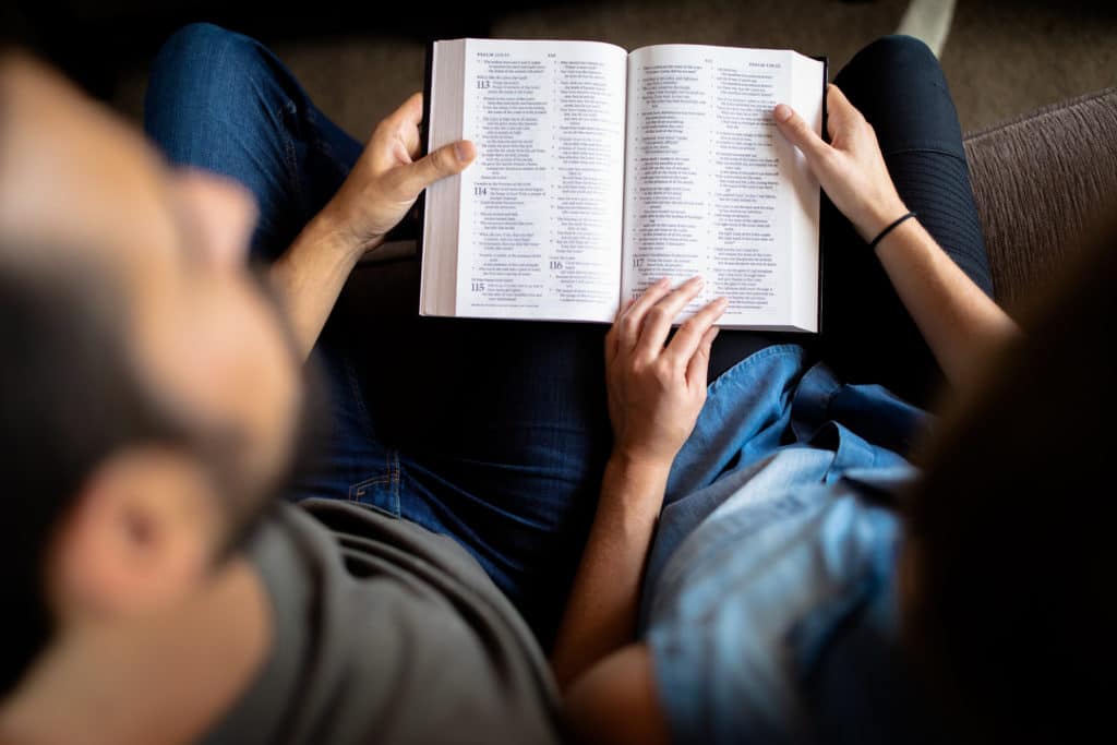 A couple reading the Bible together.