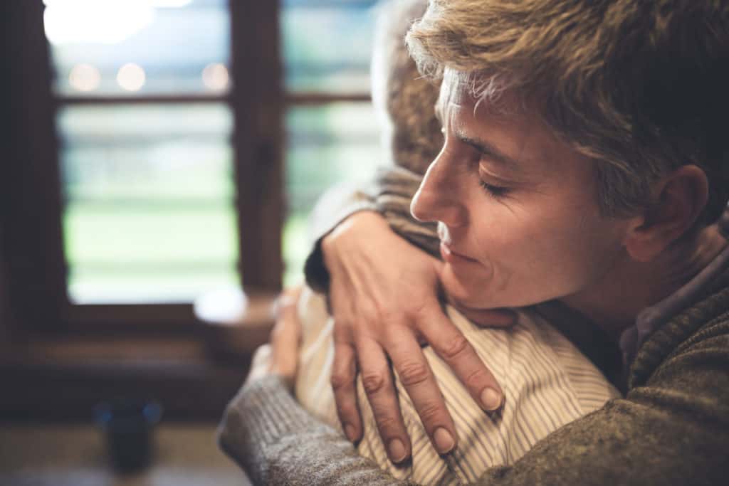 Senior couple embracing.