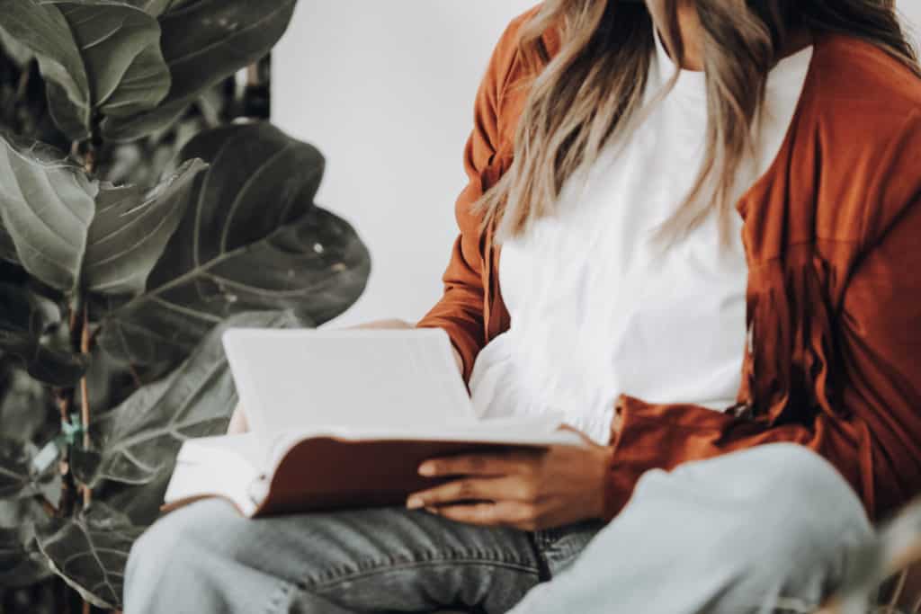 A woman reading the Bible.