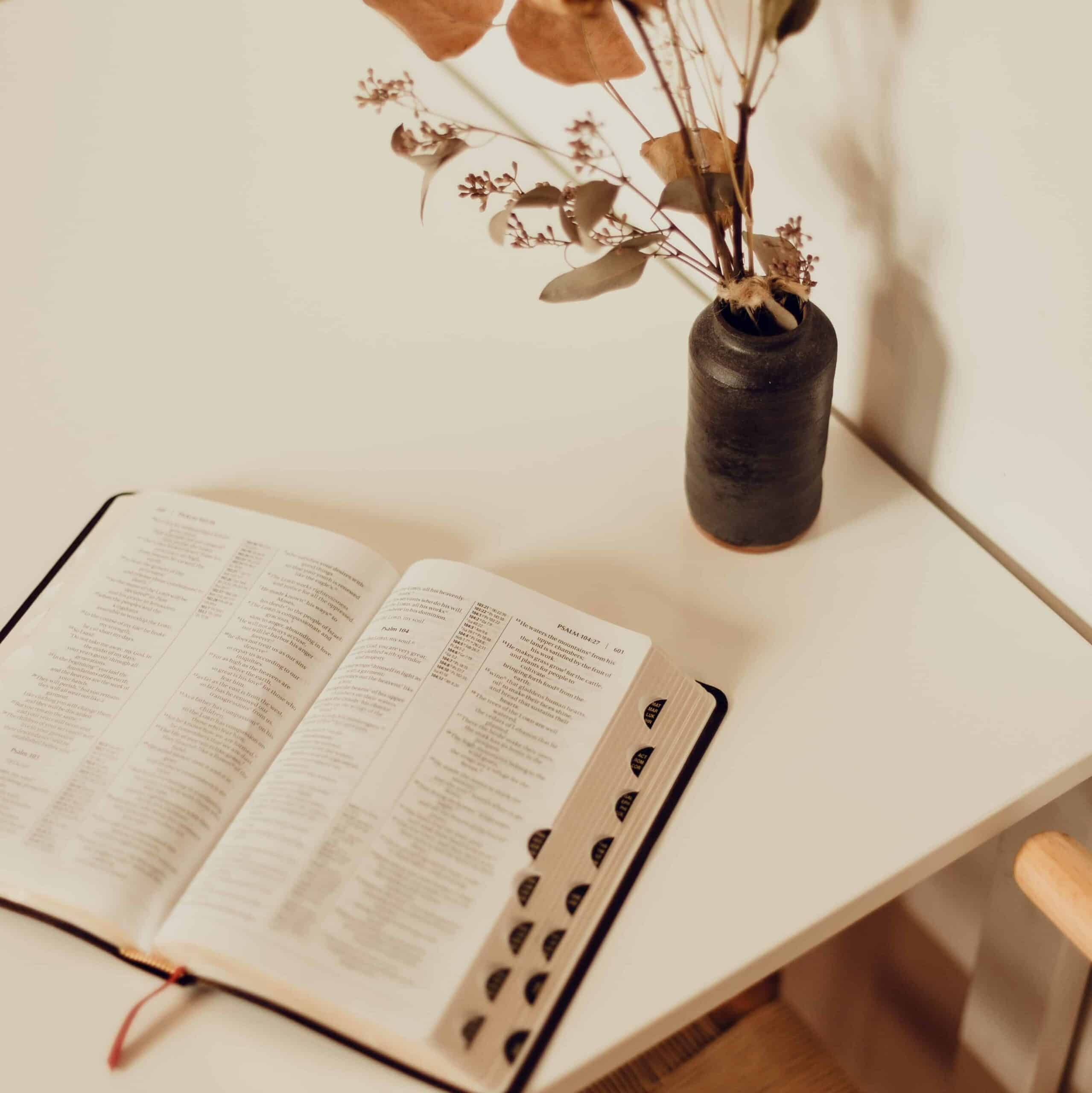 A Bible laying open on a table.