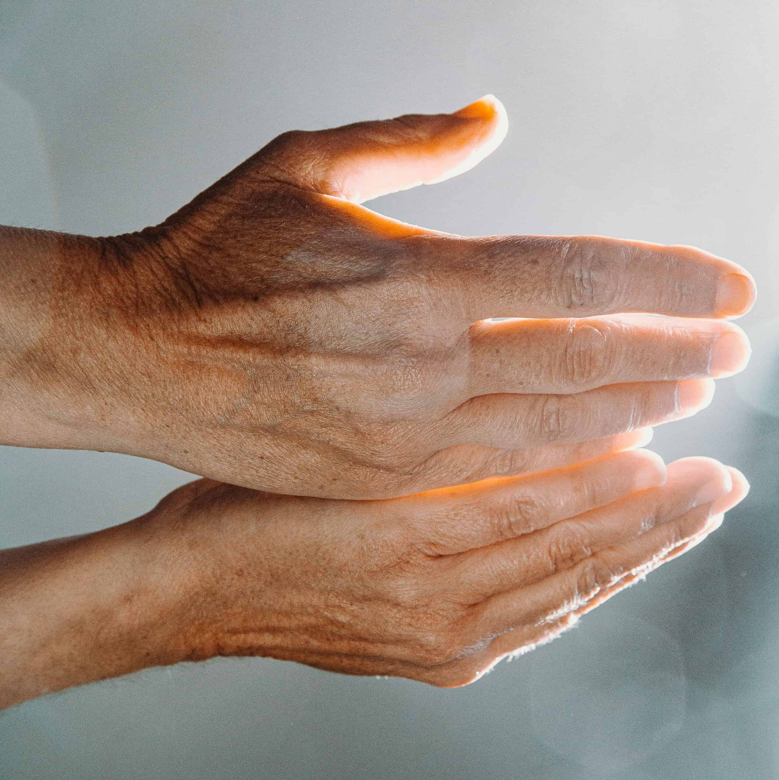 A person holding out cupped hands.