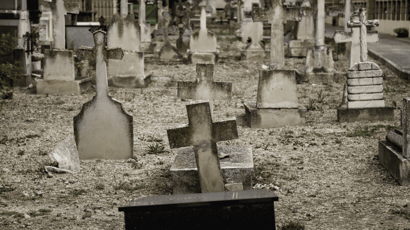 Picture of a grave yard, full of old head stones. 