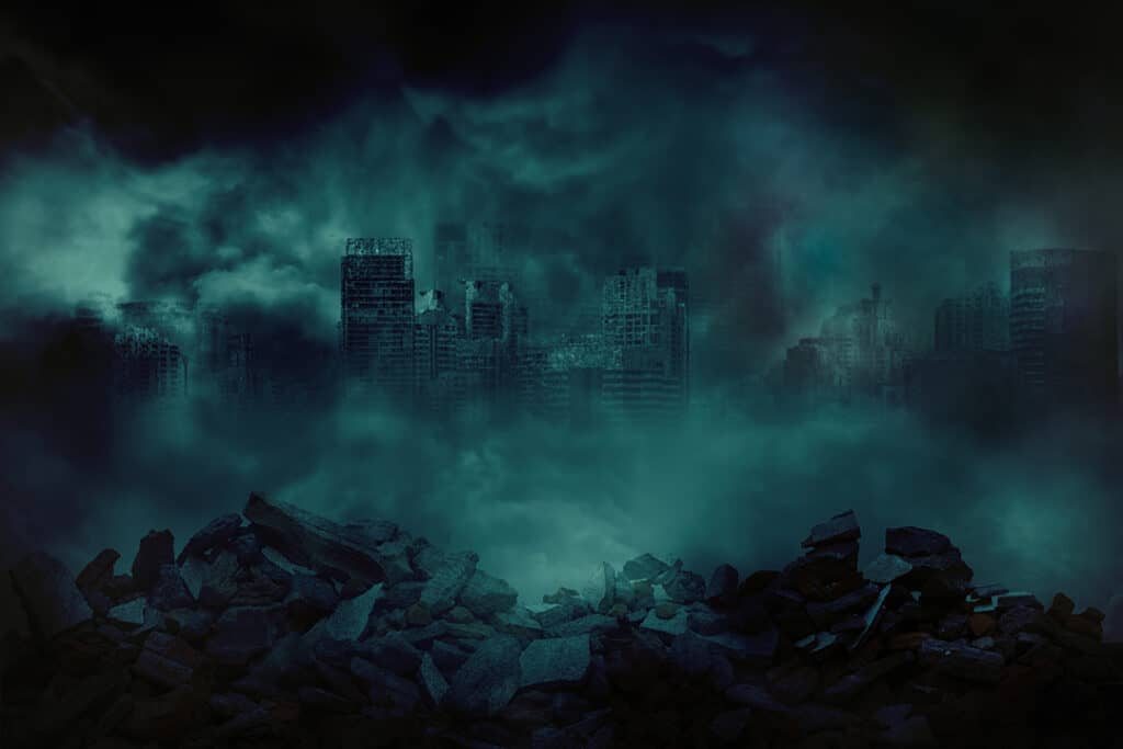 A city with ruble in the foreground and building falling down behind wrapped in think green smoke.  
