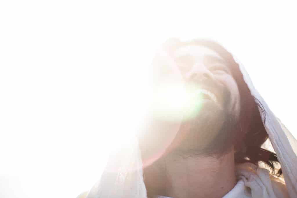 Man smiling while looking up.