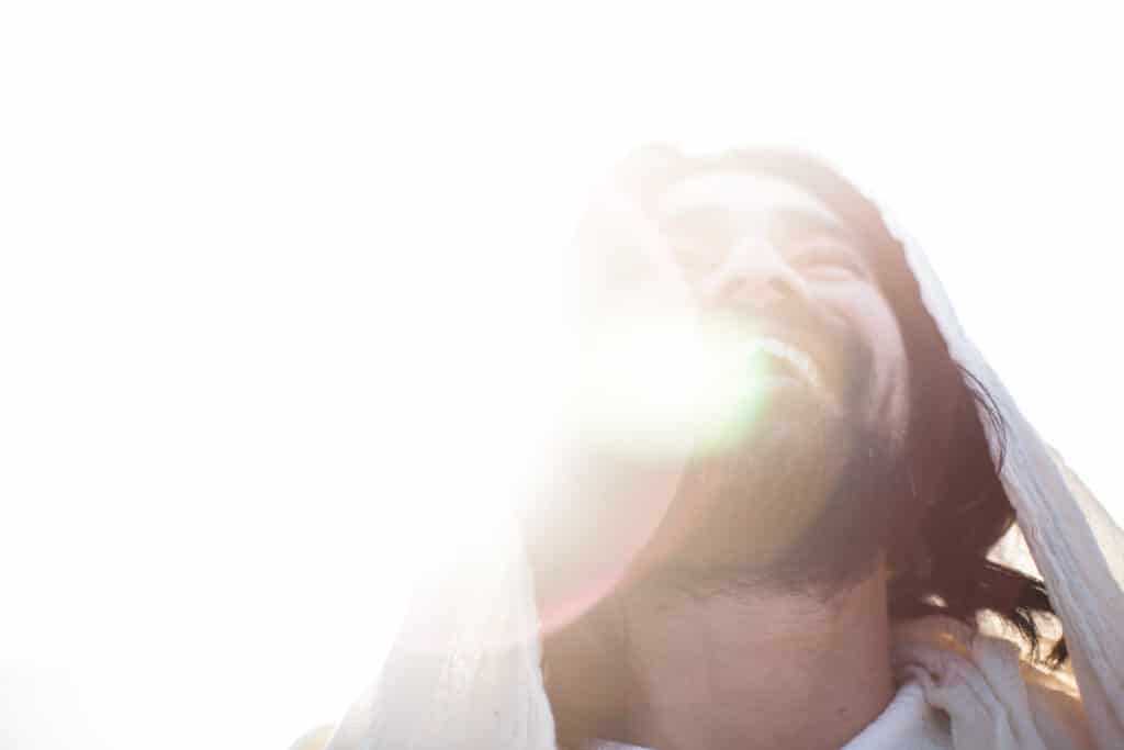 Man smiling while looking up. 