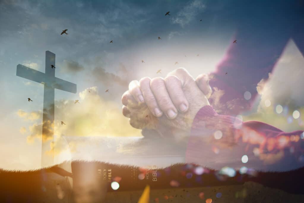 Jesus Forgives Hands clasped in prayer overlayed over the cross Jesus died on, reminding us that Jesus gave us ultimate forgiveness.