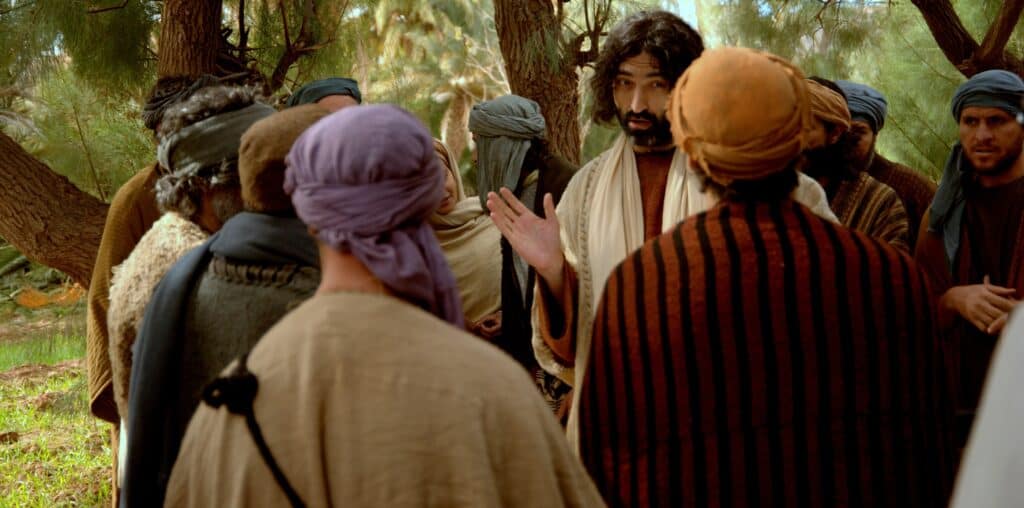 A crowd around Jesus listening to Him teach about the Holy Spirit.