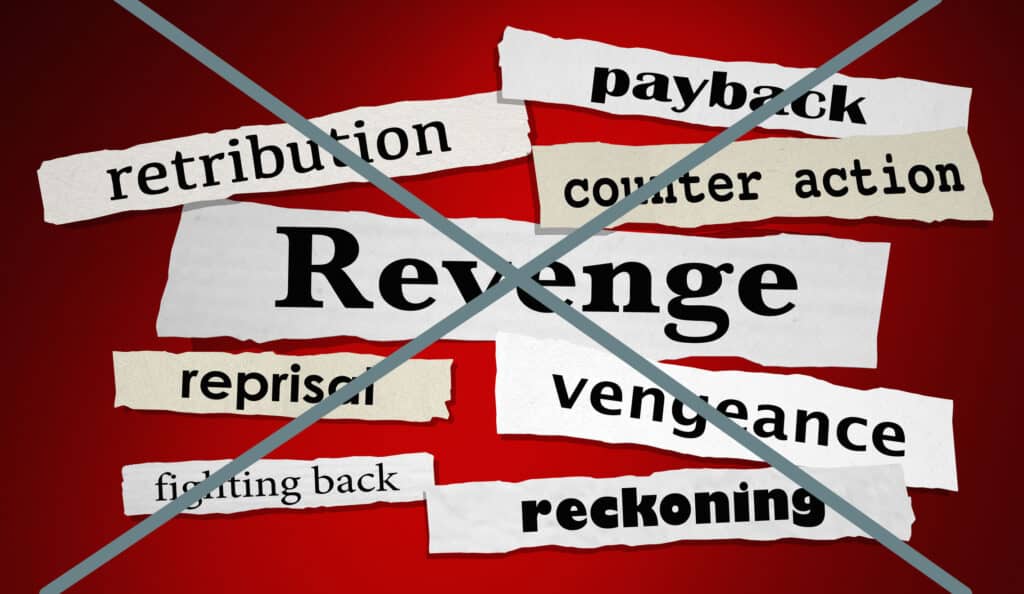 Many different thoughts of getting back at someone on strips of paper, like revenge, payback, retribution, but they are all crossed out.